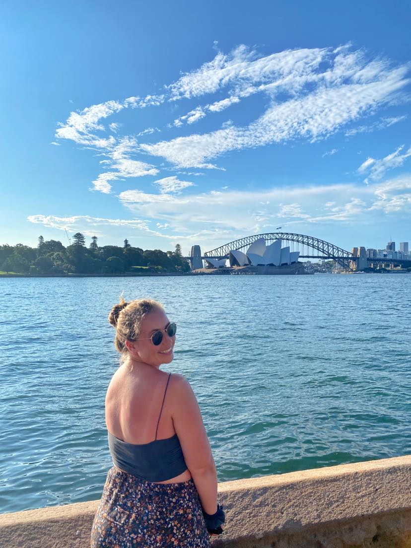 smiling girl in front of Sydney Opera House